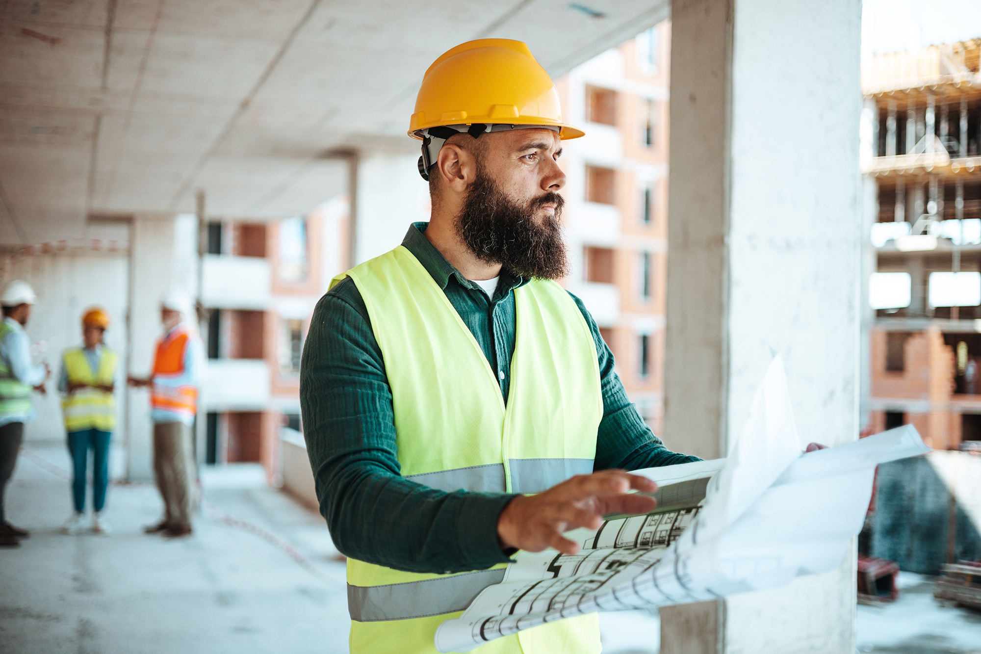 Foreman reviewing blueprints on a construction site